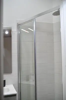 a shower with a glass door in a bathroom at BFabretti5 in Rome
