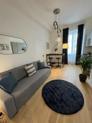 a living room with a couch and a table at Giulio Cesare Comfort Rooms in Rome