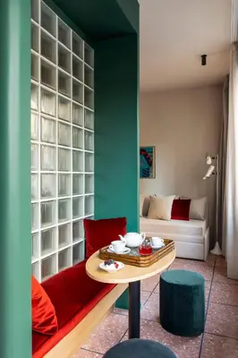 a living room with a table and a couch at ATEL Relais in Rome