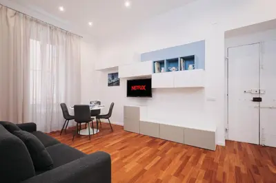 a living room with a couch and a table at Castel Sant'Angelo - Elegant flat in Rome Centre in Rome
