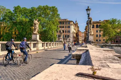 a group of people riding bikes on a bridge at Authentic Central Roman Home - Metro 7min, 5min to Rome Center, AC, Wi-Fi in Rome