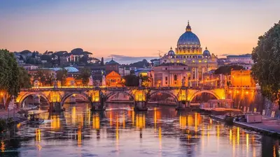 a view of a bridge over a river with a cathedral at Authentic Central Roman Home - Metro 7min, 5min to Rome Center, AC, Wi-Fi in Rome