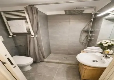 a bathroom with a toilet and a sink at Vatican Prestige Suite 