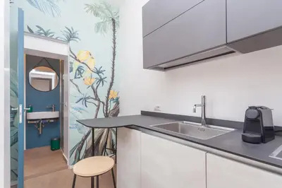 a kitchen with a sink and a counter top at Rhome Vatican Chic in Rome