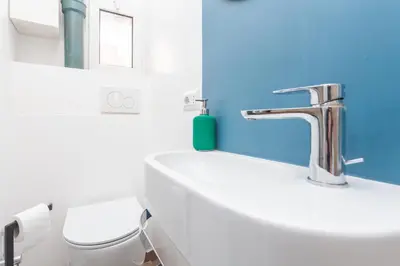 a bathroom with a sink and a toilet at Rhome Vatican Chic in Rome