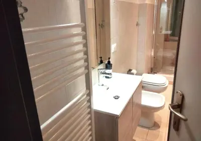 a bathroom with a sink and a toilet at Casita in Rome