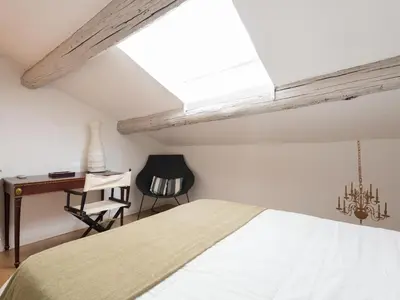 a bedroom with a bed and a desk and a chair at Central Rome Terrace Apartment in Rome