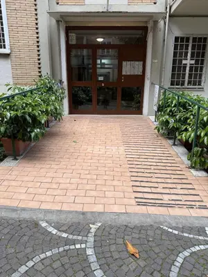 a door to a building with a brick walkway at Sweet Life Monteverde in Rome