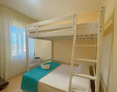 a bedroom with two bunk beds and a ladder at MARIA TERESA Apartment - Sophisticated Living and City Links - Quartiere TRIESTE in Rome