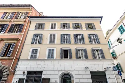 a tall building in the middle of two buildings at Boutique Atrium Pantheon in Rome