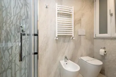 a bathroom with a toilet and a sink and a shower at Boutique Atrium Pantheon in Rome