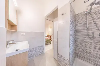 a bathroom with a sink and a shower at vaticanloft for you in Rome