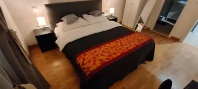a bedroom with a large bed and a desk at B&B Lorenzo 7HillsRoma in Rome