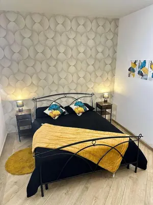 a bedroom with a large bed and two tables at MaLoMA Home intero alloggio fronte metro A in Rome