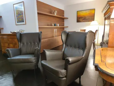 two chairs in a room with a table at Banchi Nuovi Ventuno in Rome