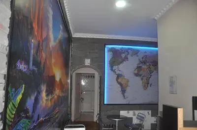 a large mural of a world map on a wall at Friends Holiday in Rome