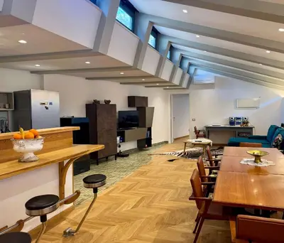 a large room with wooden tables and chairs at Caracalla Loft in Rome