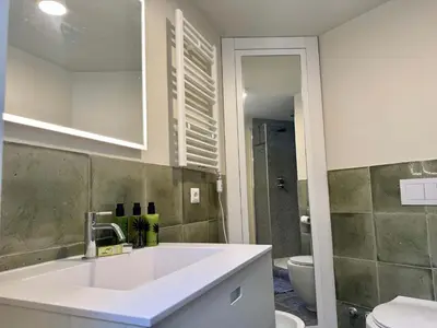 a bathroom with a sink and a toilet at Caracalla Loft in Rome