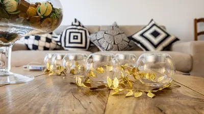 a group of wine glasses on a wooden table at Casa Maria Teresa by Rentbeat in Rome