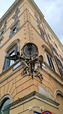 a clock on the side of a building at Elegant Suite Colosseo in Rome