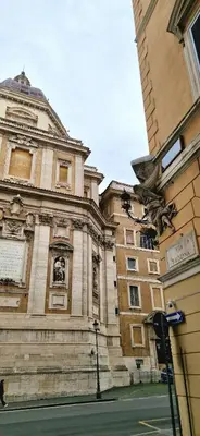 a building on a street next to a building at Elegant Suite Colosseo in Rome