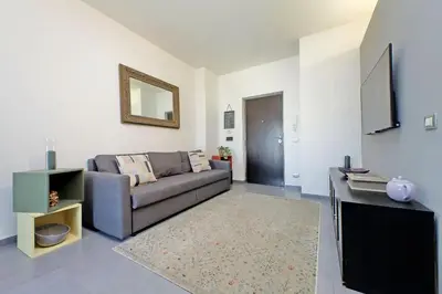 a living room with a couch and a mirror at Manzoni in Rome