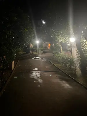 an empty street at night with street lights at Trecento7Flat in Rome