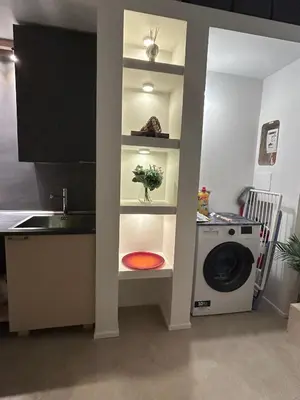 a kitchen with a sink and a washing machine at Trecento7Flat in Rome