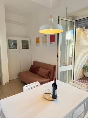 a bottle of wine on a table in a living room at Gianicolo Trastevere Exclusive Apartments in Rome