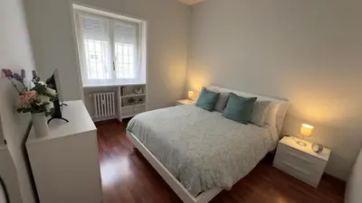 a small bedroom with a bed and a window at Civico 10 Home in Rome