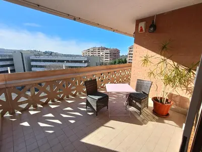 a patio with a table and chairs on a balcony at F&F Rome Apartment - 2 Bedrooms Aurelio Boccea in Rome