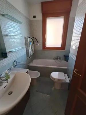 a bathroom with a tub and a toilet and a sink at F&F Rome Apartment - 2 Bedrooms Aurelio Boccea in Rome