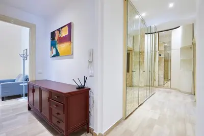 a bathroom with a walk in shower and a wooden cabinet at Relax a Trastevere in Rome