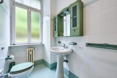 a bathroom with a toilet and a sink at Relax a Trastevere in Rome