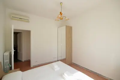 a white couch in a room with a white wall at HC - Stadio Olimpico Huge Apartment NEW in Rome