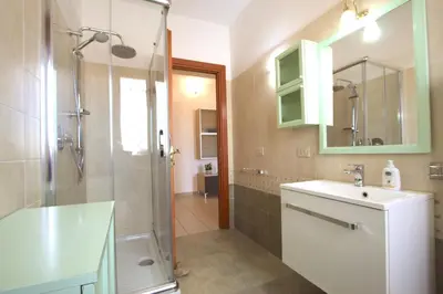 a bathroom with a sink and a shower at Manuela Holiday House in Rome