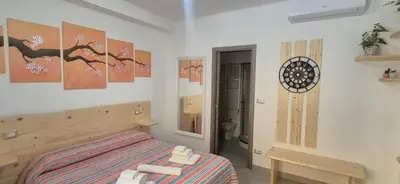 a bedroom with a bed and a mirror in it at Leone Bed & Dreams in Rome