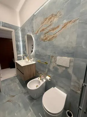 a bathroom with a toilet and a sink at La Martinella a Roma in Rome