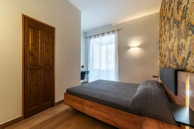 a bedroom with a bed and a window at GuestHost - Domus Antoniana - Esquilino in Rome
