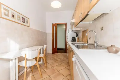 a kitchen with a sink and a counter at Casa Nina Ostiense - Roma Tre - by GHOR in Rome