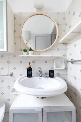 a bathroom with a white sink and a mirror at San Paolo Private Garden Home in Rome