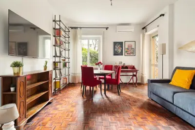 a living room with a couch and a table at San Paolo Private Garden Home in Rome