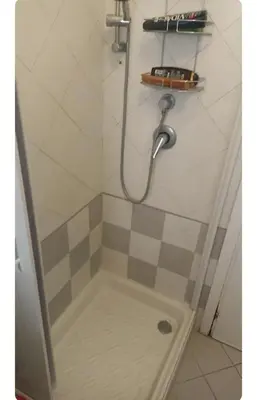 a shower with a hose in a bathroom at Casa Serenissima Holiday Home Roma Barbara Bonanno in Rome