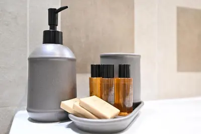 a bottle of soap and someentedentedentedentedented at Monti luxury patio apartment in Rome