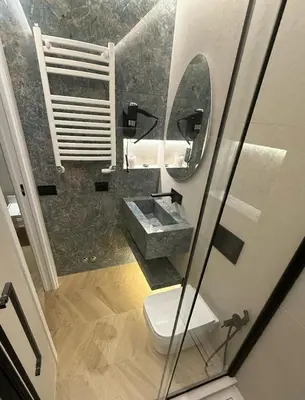 a bathroom with a sink and a toilet and a mirror at Residenza Vittorio Veneto in Rome