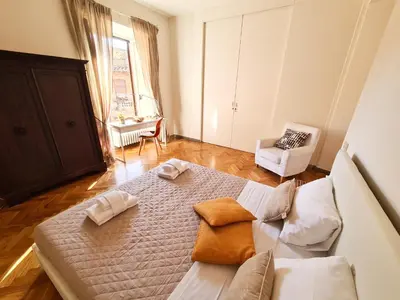 a room with a bed with two towels on it at Boutique Domus Charme Trastevere Vascellari in Rome