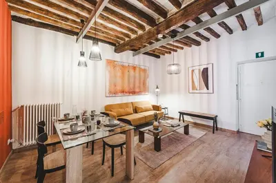 a living room with a couch and a table at Fancy Colosseum - Best location in Rome