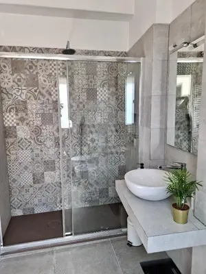 a bathroom with a sink and a shower at Monti View Apartment in Rome