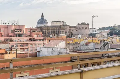 a view of a city with buildings and a train at Vaticano-Metro A 1 min, Urban Rooftop in Rome