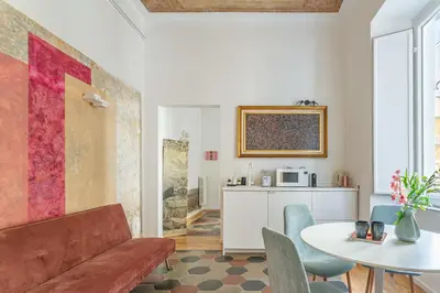 a living room with a couch and a table at iFlat New Boutique Apartment in Rome's Heart in Rome